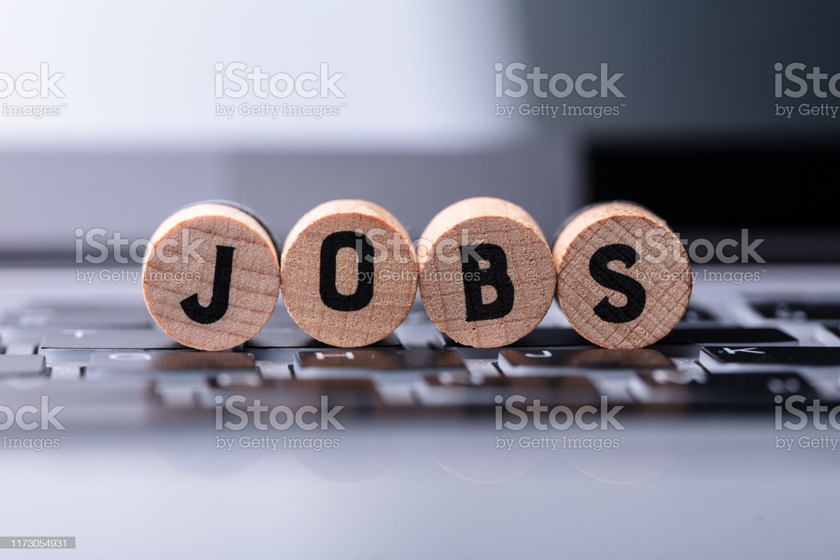 Close-up Of Jobs Text On Wooden Blocks Over Keyboard In Office